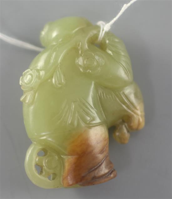 A Chinese yellow and russet jade boy pendant, 4cm
